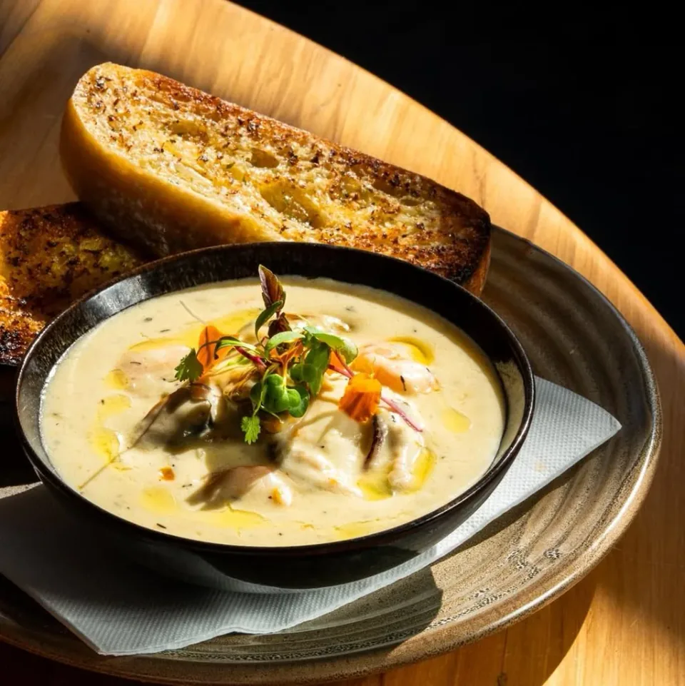 Seafood chowder served with toasted bread