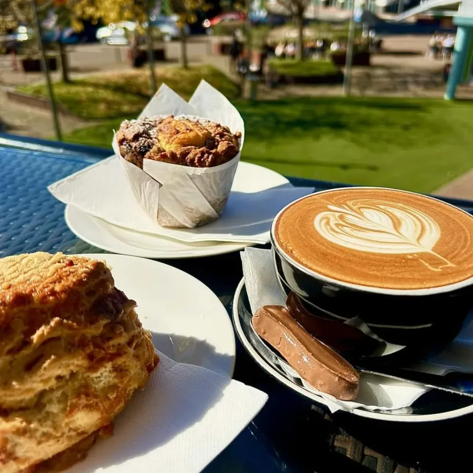 Muffin and coffee on a café table